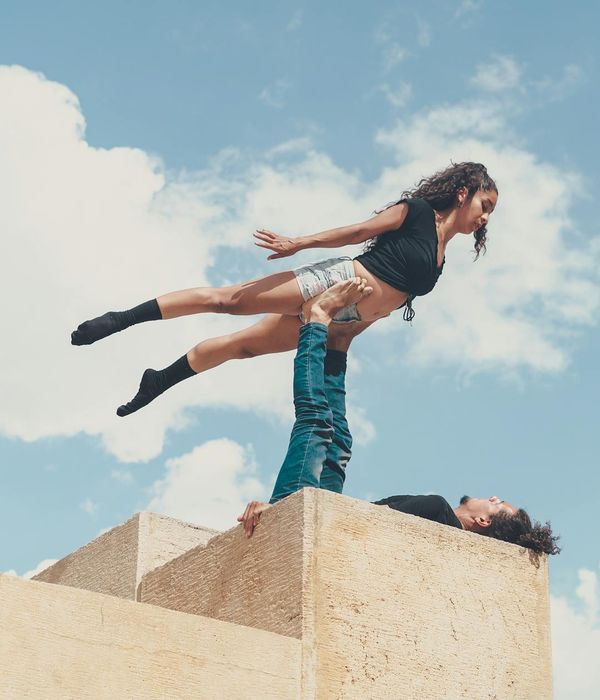 Man performing a low-intensity strength exercise in a minimalist environment.